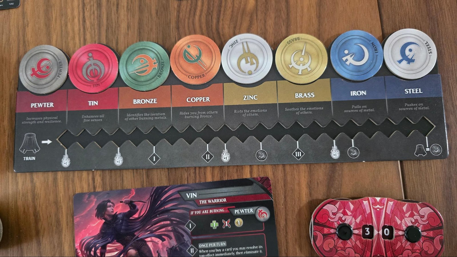 Componentes do jogo Mistborn Deckbuilding