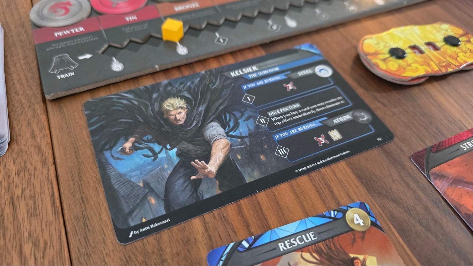Referência aos personagens de Era 1 no jogo Mistborn: Deckbuilding Game